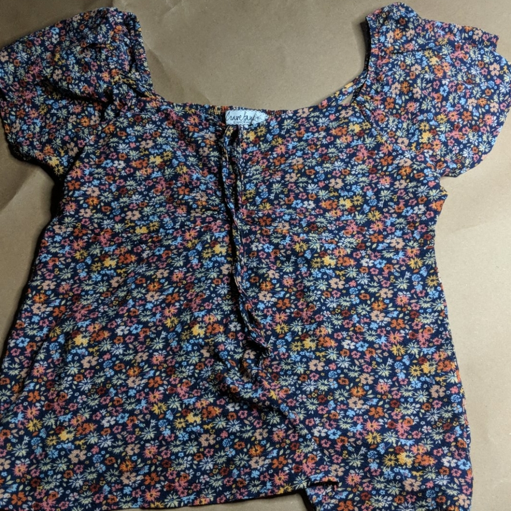 Floral front scrunched shirt with frilly sleeves.